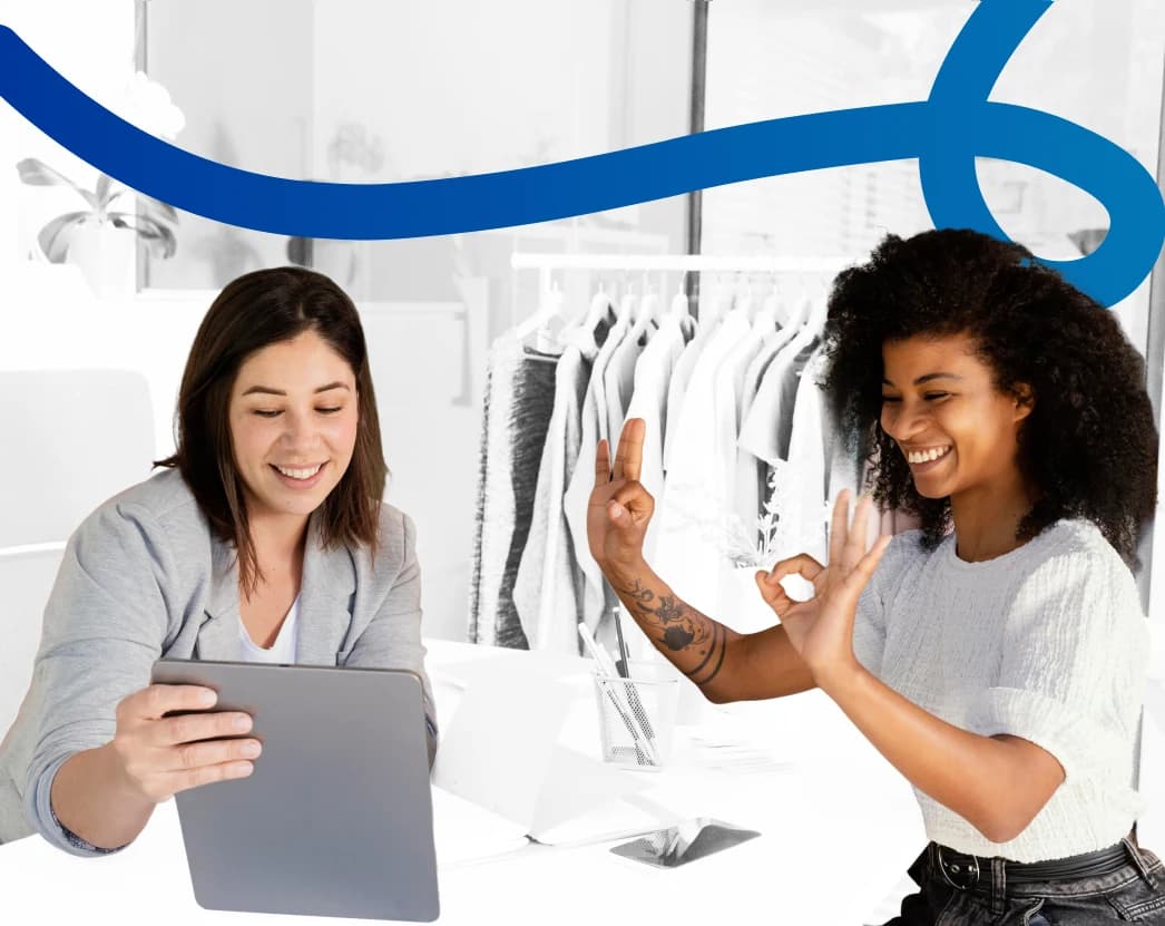 two girls are smiling