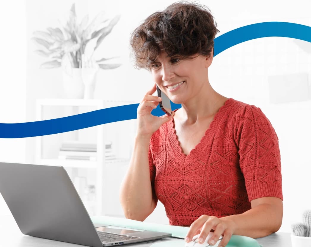 Woman making virtual phone call working from home with laptop